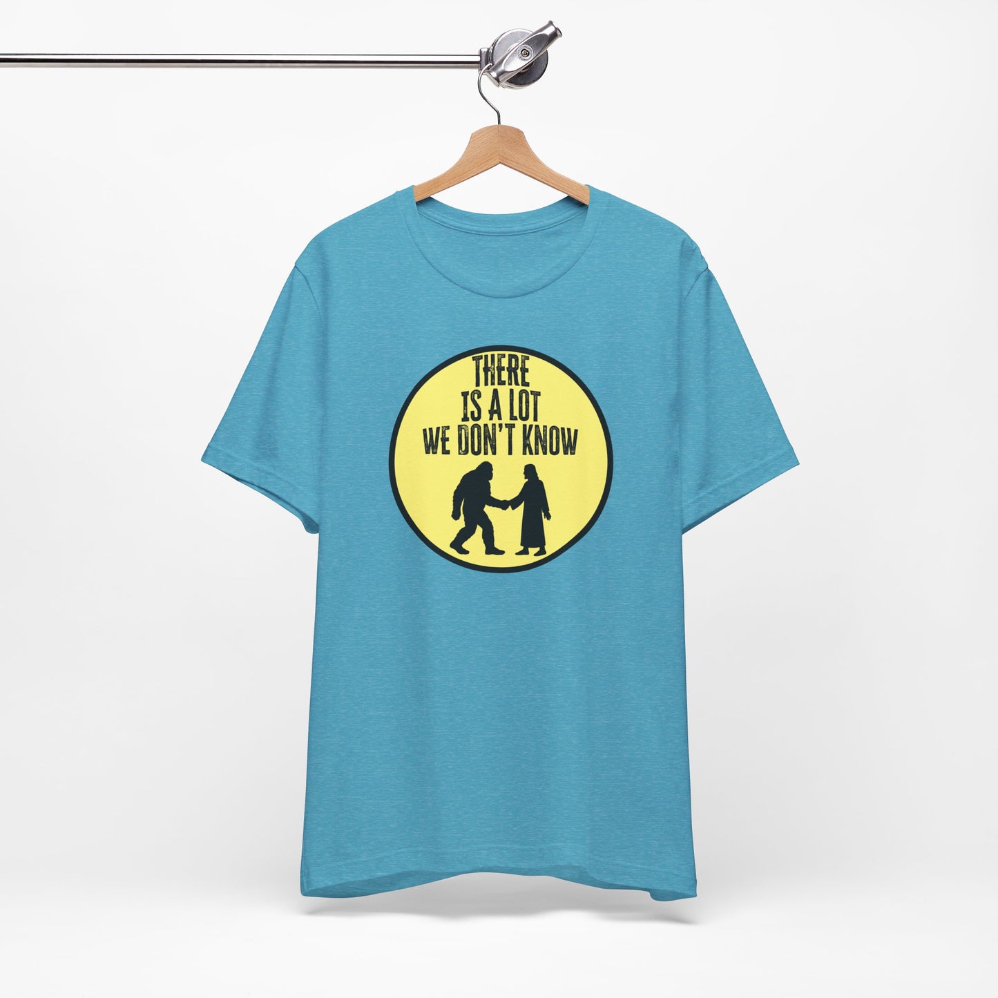 'There Is A Lot We Don't Know" (Bigfoot Meets Jesus) (Soft, Quality Bella & Canvas <Or Comparable> Unisex Tee)