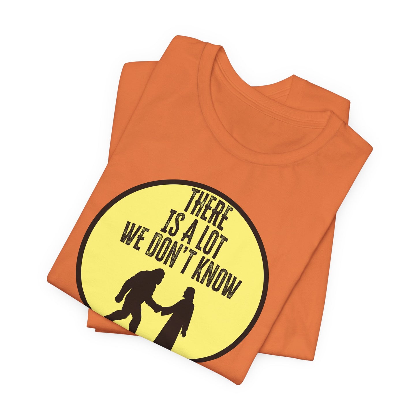 'There Is A Lot We Don't Know" (Bigfoot Meets Jesus) (Soft, Quality Bella & Canvas <Or Comparable> Unisex Tee)